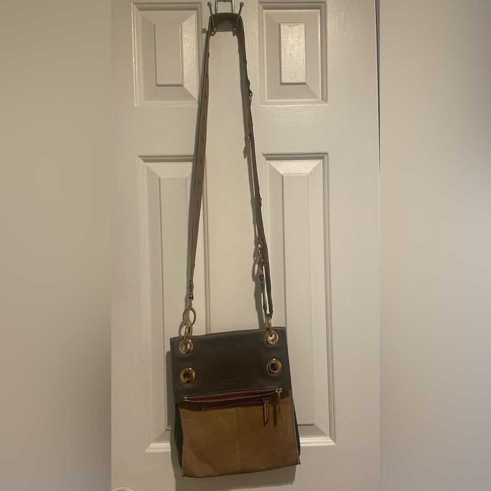 Hammett crossbody tan and gray leather with red interior. Used condition.